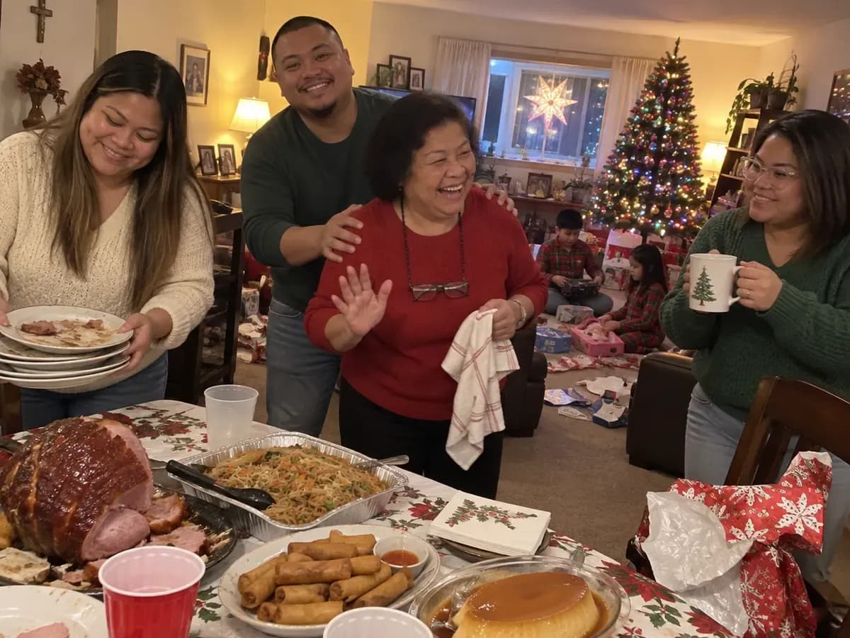 On Christmas Day after dinner, a grown son steers his laughing mother away from the table while his sisters clear the plates of ham, pancit and lumpia